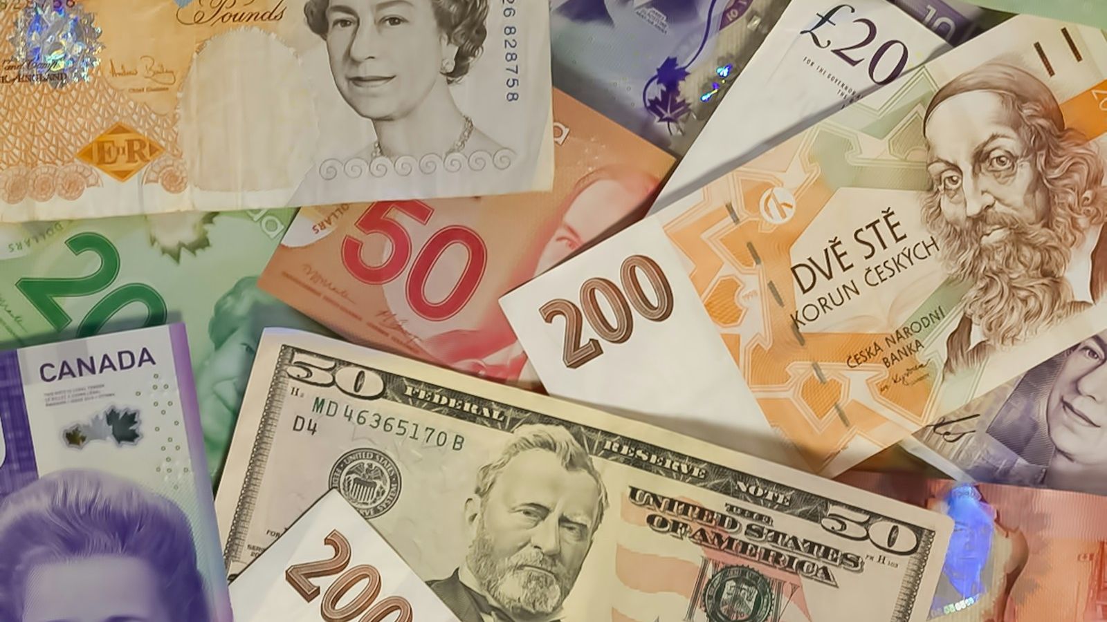 Banknotes from several countries spread out together