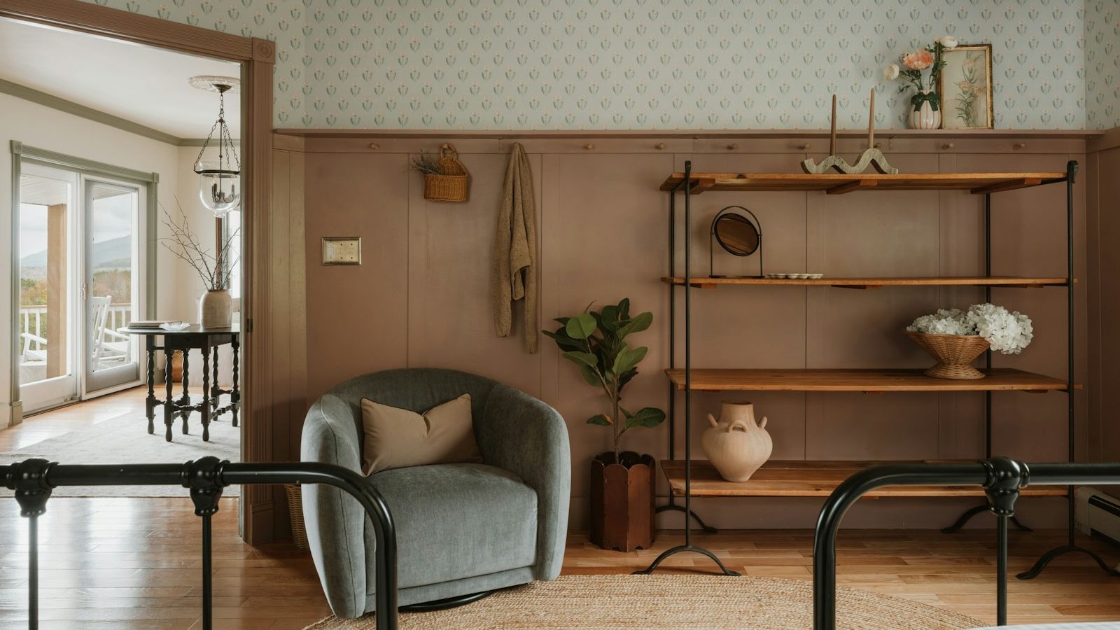 Cozy rental interior with an armchair, open shelving and beds